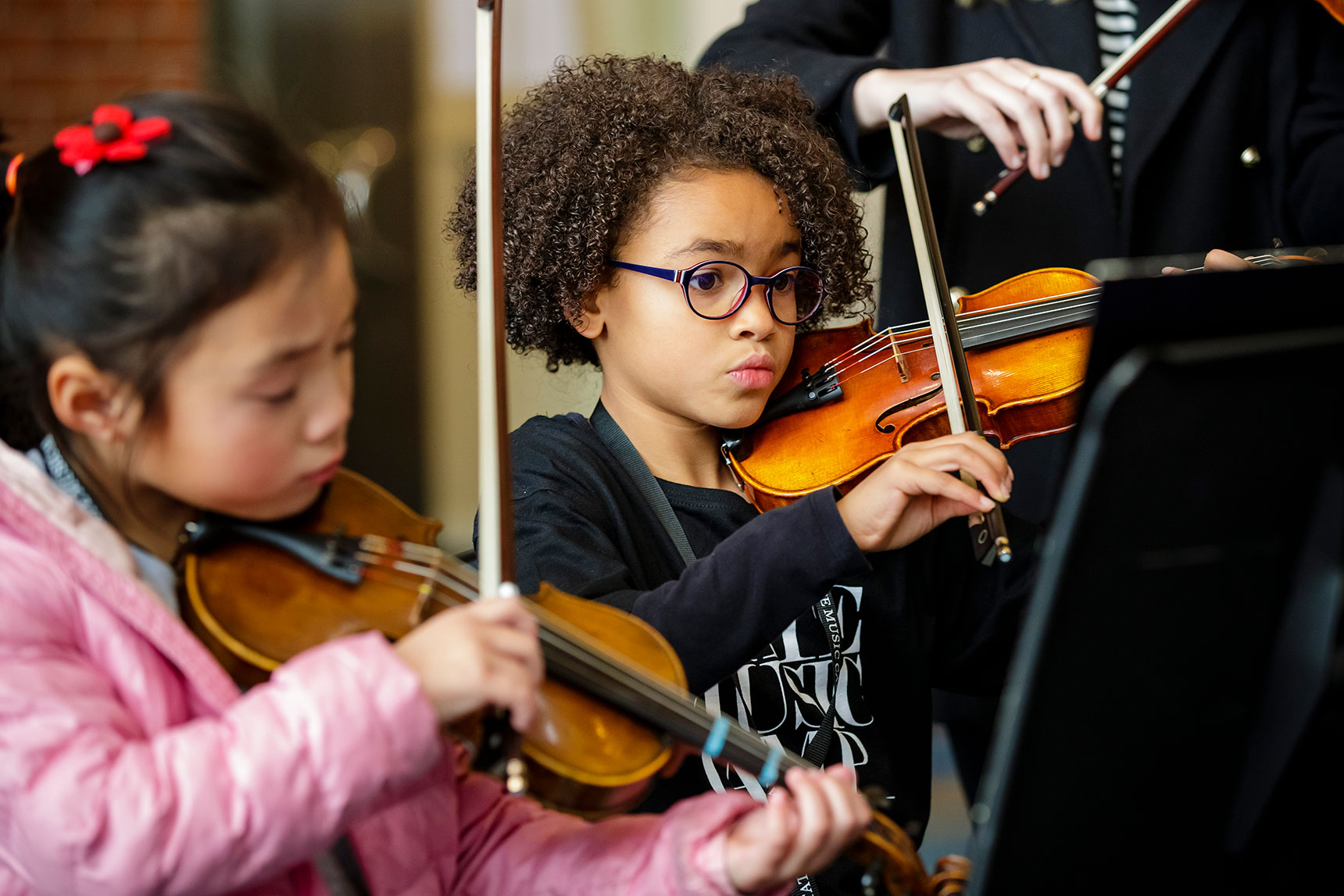 Younger child violin rear focus